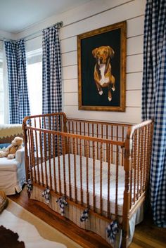 a baby's room with blue and white checkered curtains