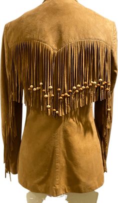 so soft fringe suede blazer with wood beads in good shape minor wear small water spot on sleeve in pic and 2 fringes are shorter on right sleeve. measurement underarm 34 waist buttoned 34 Fringe Suit Jacket, Sleeve Measurement, Luxury Fringed Leather Jacket With Long Sleeves, Fringe Blazer, Chic Long-sleeve Leather Jacket With Fringe, Soft Fringe, Dkny Bag, Suede Blazer, Brown Long-sleeve Fringe Outerwear