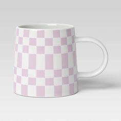 a pink and white checkered coffee mug