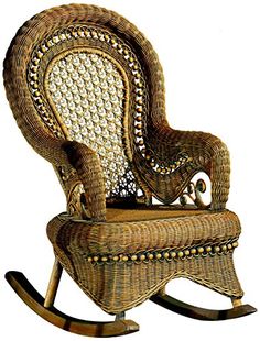 a wicker rocking chair with an intricate design