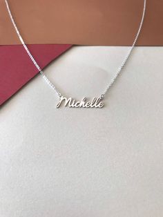 "Mothers Day Gift -Personalized Handmade Silver Jewelry Crafted with love from solid sterling silver-Christmas day gift -Valentines day gift-Birthday gift-Anniversay Gifts Name necklace * Gold Necklace * Mini Necklace * Bridesmaid Gift * Personalized Gifts * Tiny Name Necklace * Gift For Mom * Gift For Women This necklace is for you .Type the name you want to explain.If you have a different question,you can ask any time from the messages section. -About Us- DreamNecklaceArt Produces this necklac Silver Custom Name Necklace, Custom Name Necklace In White Gold, Dainty Silver Charm Necklace With Custom Name, Custom Name White Gold Necklace For Gift, Nickel Free Sterling Silver Name Necklace, Custom Name White Gold Necklace As A Gift, Dainty Silver Nameplate Custom Necklace, Personalized White Gold Necklace For Gift, Nickel-free Sterling Silver Name Necklace