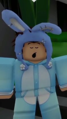 an animated image of a person dressed as a bunny with his hands in the air