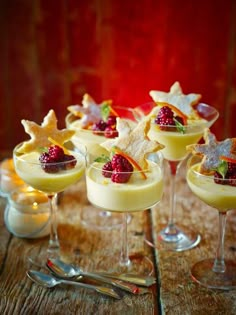 small desserts are arranged in glasses on a table