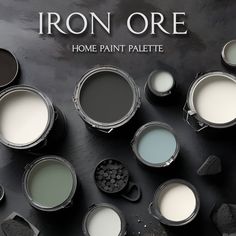 some paint cans are shown with the words iron oree on them and other paints