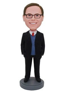 a bobble head with a man in a suit and tie on top of a white background