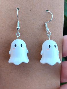 Adorable little ghosts on silver plated earring hooks. White Novelty Dangle Jewelry, Novelty White Dangle Jewelry, Novelty White Pierced Jewelry, Novelty White Earrings For Pierced Ears, Cute White Halloween Earrings, Handmade Kawaii Silver Earrings, Novelty White Dangle Earrings, Handmade White Earrings For Halloween, Novelty White Drop Earrings