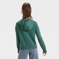 Why we're ALL IN: Hooded pullover sweatshirt in a solid hue made from lightweight cotton-recycled polyester blend fleece fabric. Features a front full-length zipper for easy on and off and versatile styling. Thumbholes offer extra coverage and help keep their hands warm on chilly days. All in Motion™: Inspiring the potential in every body. Green Fleece Athleisure Hoodie, Green Fleece Hoodie In Athleisure Style, Solid Color Stretch Fleece Hoodie, Solid Stretch Fleece Hoodie, Hoodie With Ribbed Cuffs For Outdoor Activities, Sports Hoodie Sportswear, Half-zip Fleece Hoodie Sportswear, Sports Fleece Hoodie In Solid Color, Fall Moisture-wicking Hooded Hoodie