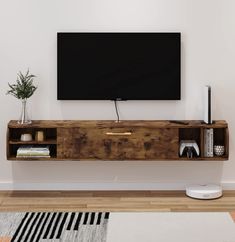 a flat screen tv mounted to the side of a wooden shelf in a living room