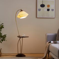 a living room scene with focus on the floor lamp and coffee table in the corner