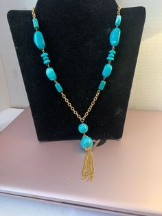 20 inch goldtone tassel necklace Gold Tassel Dangle Necklace Gift, Beaded Chain Dangle Necklace Costume Jewelry, Gold Tassel Dangle Necklace, Elegant Gold Tassel Necklace With Dangling Beads, Gold Long Tassel Necklace, Gold Long Tassel Necklace With Adjustable Fit, Gold Long Necklace With Tassels, Elegant Turquoise Jewelry With Tassels, Gold Long Necklace With Dangling Beads