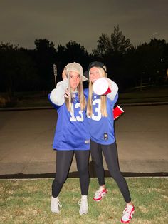 two women in sports uniforms posing for a photo