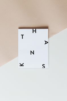 a white square with black letters on it and the words ah, n, s