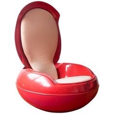 an oval shaped container with a seat inside