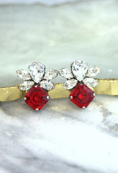 Red Crystal Earrings, Ruby Red Crystal Stud Earrings, Princess Cut Red Earrings, Bridal Red Stud Earrings, Bridesmaids Red Earrings, Red Crystal Drop Earrings For Wedding, Red Ruby Earrings For Wedding, Elegant Red Cluster Earrings For Anniversary, Red Ruby Wedding Earrings, Elegant Red Cluster Earrings For Wedding, Red Drop Earrings For Wedding, Red Drop Bridal Earrings As Gift, Red Drop Earrings For Bridal Gift, Red Clip-on Earrings For Wedding