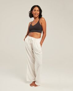 Relaxed-fit trousers in lightweight organic cotton that’s both cosy and cooling. Now available in two lengths Regular and Petite.  ### A classic pyjama trouser silhouette, adorned with signature Nudea detailing and a drawstring waist for maximum comfort and ultimate lounging possibilities. Pair with The Midi Shirt or The Tank to complete this dreamy look. Crafted with 100% natural materials Regular: Outer leg measurements: 106. 5cm, inner leg: 79cm. Petite: Outer Leg measurement: 100cm, inner leg: 74cm. ### Margherita and Amelia wear size M 100% GOTs certified Cotton Machine Washable on a cold cycle Cotton Wide Leg Sleepwear For Relaxation, Wide Leg Cotton Sleepwear For Relaxation, Straight Leg Cotton Sweatpants For Yoga, Relaxed Cotton Sleepwear For Everyday, Cotton Wide Leg Ankle-length Pants For Lounging, Relaxed Cotton Wide Leg Pants For Loungewear, Relaxed Cotton Pants For Relaxation, Cotton Yoga Pants With Elastic Waistband For Loungewear, Versatile Cotton Bottoms For Relaxation