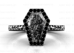 a black and white ring with an intricate design