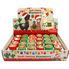 an assortment of self - inking stampers in a box with santa's hat and llamas