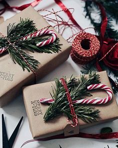 two wrapped presents sitting on top of a table