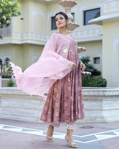 This is a beautiful 3-piece set. It comes with cotton hand block print anarkali kurta with 32 kali has 3/4th flared sleeves, square neck & ankle length.The set also comes with handblock print pants with elasticated waistband and kota doria dupatta with gota patti detailing. Color-Purple & Peach Kurta Fabric-Voil Cotton Bottom Fabric-Voil Cotton Dupatta Fabric-Kota Doria Work-Block Print & Gota Patti Detailing Neck-Square Neck Sleeves-3/4th Flared Sleeves Washing Care-Dry Clean Only Pink Kalamkari Print Straight Salwar Kameez, Pink Kalamkari Print Straight Kurta Salwar Kameez, Pink Straight Kurta Salwar Kameez With Kalamkari Print, Pink Anarkali Palazzo Set With Printed Motifs, Pink Kalamkari Print Kurta For Diwali, Fitted Pink Block Print Salwar Kameez, Transitional Pink Kurta With Printed Motifs, Pink Long Sleeve Anarkali Set With Printed Motifs, Festive Pink Kalamkari Kurta