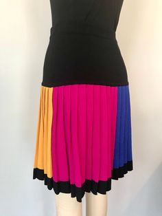 "Fun 80s Vintage knit mini skirt Color blocked Pleated tag: Liz Claiborne/size PS measurements; waist-28-32\" stretchy total length-20\" material: wool rayon blend knit color: yellow, black, red, hot pink, electric blue condition:good, has mended spots-please see last close-up pictures" Multicolor Retro Stretch Skirt, Multicolor Retro Mini Skirt, Color Block Fitted Mini Skirt, Fitted Color Block Mini Skirt, Fitted Multicolor Color Block Skirt, Retro Multicolor Fitted Mini Skirt, Knit Mini Skirt, Pleat Skirt, 80s Vintage