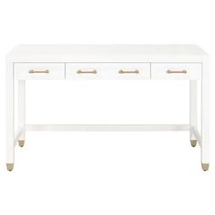 a white desk with two drawers and gold handles on the bottom, against a white background