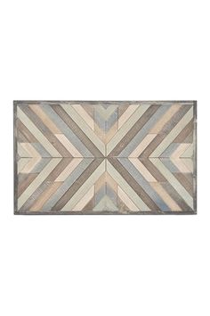 a wooden wall hanging with an abstract design