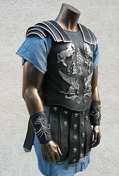 a mannequin dressed in armor and holding his hands behind his back to the camera