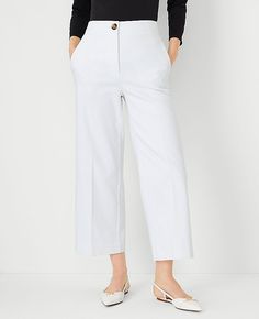 Elevate your wardrobe with the chic sophistication of Ann Taylor's The Kate Wide Leg Crop Pant. Perfectly tailored to flatter your figure, these pants boast a high-rise fit that sits just below the natural waist and a wide leg silhouette that adds a modern twist to your ensemble. The crisp white color enhances its versatility, making it a must-have for any fashion-forward wardrobe.

- Size: 4
- Color: White
- Gender: Female
- Material: 52% Cotton, 45% Polyester, 3% Elastane
- Fit: Tailored and f Cropped Wide Leg Pants With Welt Pockets For Work, Business Casual Wide Leg Cropped Pants With Pockets, Chic Cropped Wide Leg Pants For Business Casual, Elegant Cropped Wide Leg Pants With Pockets, Classic Wide Leg Culottes For Spring, Wide Leg Dress Pants With Welt Pockets For Spring, Spring Workwear Straight Culottes, Spring Wide Leg Ankle-length Pants With Welt Pockets, Spring Ankle-length Wide Leg Pants With Welt Pockets