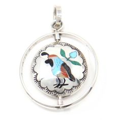 Captivating spinner pendant designed by the exquisite Zuni Artist Quentin Quam, displaying an intricate quail on one side and a roadrunner on the other side. A radiant 1 3/8" x 1" design. Pendant Design, Pendant, Design