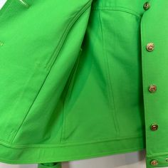 St. John Sport by Marie Gray Green Jacket. Has light shoulder pads. Gold details throughout including logo buttons. Bright green colored lightweight jacket. Collared jacket with button down front. Rivets on the collar and bottom hem. This item have been hemmed at the cuff, however the hem can be let out and returned back to its original cuff length, as shown in photos. Made in the USA Women's size Small Petite Measurements with the garment laying flat: Pit to pit: about 19 inches Length: about 2 Collared Jacket, Gray Green, Green Jacket, Lightweight Jacket, Bright Green, Gold Details, Rivets, St John, Made In The Usa