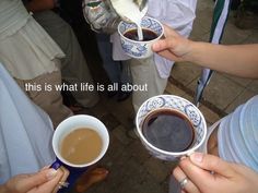 three people holding coffee cups and spoons with the words, this is what life is all about