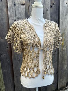 This beige crochet top is a great addition to your wardrobe, it will accessorize your outfit beautifully. Handmade with soft acrylic and cotton blend yarn in a simple design that can be mixed and matched with endless styles. This top is ready to ship! *Colors may appear differently on different devices. CARE INSTRUCTIONS Treat your handmade knitwear with love! Machine wash cold, gentle cycle. Tumble dry delicate/gentle. CONTACT If you have any questions, please do not hesitate to send me a message. RETURNS & EXCHANGES I accept returns, exchanges, and cancellations Contact me within 14 days of delivery Ship items back within 21 days of delivery Request a cancellation within 4 hours of purchase SHIPPING Ships within 1-3 business days. Blouse Crochet, Beige Crochet, Handmade Knitwear, Love Machine, Beige Top, Crochet Blouse, 4 Hours, 21 Days, Simple Design