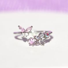 This ring is meant to wear during all the precious moments in your life. We love mixing butterfly, floral, and celestial motifs in one design. Add a pop of pink to your jewelry collection with our Precious Moments Ring. Celestial Motifs, Precious Moments, One Design, 18k Rose Gold, Rose Gold Plates, Rose Gold Ring, Rhodium Plated, Cubic Zirconia, Gold Rings