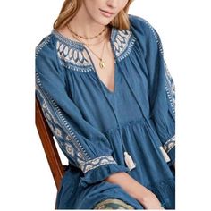 Broad Ruffle With Elegant Embroidery At The Neck And Sleeves And Feminine Appeal To This Tie-Neck Top By Free People. - Tie Closure - V-Neck - 3/4 Blouson Sleeves. Bohemian Blue Embroidered Top With Geometric Patterns, Blue Bohemian Top With Intricate Embroidery, Blue Folk Style Top With Embroidered Hem, Blue Cotton Embroidered V-neck Top, Blue V-neck Embroidered Top With Floral Details, Blue Casual Embroidered V-neck Top, Blue Folk Style Top With Embroidered Neckline, Blue Folk Embroidered Top With Neckline Detail, Blue Folk Embroidered Top With Embroidered Neckline