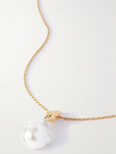 Bottega Veneta's necklace features a sculptural pearl. Crafted in Italy from gold-tone metal, it has an elongated chain that looks especially chic when framed by a v-neckline. Luxury Gold-tone Jewelry With Pearl Pendant, Luxury Gold-tone Pearl Chain Necklace, Luxury Long Pearl Charm Necklace, Luxury Long Necklace With Pearl Charm, Luxury Pearl Pendant Chain Necklace, Luxury Pearl Chain Necklace, Luxury Pearl Necklace With Adjustable Chain, Luxury Pearl Chain Necklace With Round Pendant, Luxury Long Necklace With Pearl Pendant