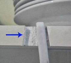 a close up of a metal object with an arrow pointing to it