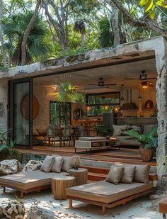 an outdoor living area with couches and tables