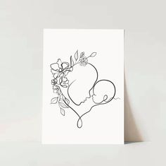 a black and white drawing of a heart with flowers on it