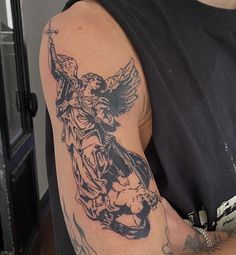 a man with a tattoo on his arm