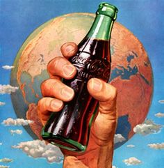 a man holding up a beer bottle in front of the earth