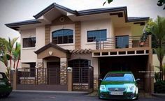 a green car parked in front of a two story house