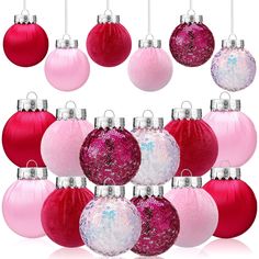 pink and red ornaments are hanging from the ceiling with silver accents on each ornament