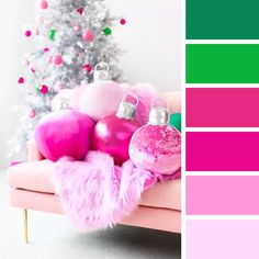 a pink and green color scheme with christmas ornaments on a couch in front of a tree