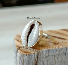 Cowrie Shell Ring*925 Sterling Silver Ring*Handmade Ring*Dainty Ring*Shell Ring*Statement Ring*Beautiful Ring*Women Ring*Gift For Her ---------------------------------------------------------------------------------------------------------------------------------------------------- Cowrie Shell Ring, Handmade Ring, Gemstone Ring, Statement Ring, 925 Silver Ring, Boho Ring, Dainty Ring, Women Ring, Gift For Her All my Designs are original. Cowrie Shell Ring This is a classy fine hand-crafted stur White Stackable Wedding Rings Stamped 925, Nickel-free White Stackable Rings As Gift, White Hallmarked Stackable Rings As Gift, Nickel Free White Toe Ring, White Toe Ring As A Gift, Handmade White Stackable Open Rings, Handmade White Open Stackable Rings, Bohemian White Midi Rings For Gift, Bohemian White Midi Rings As Gift