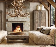 a living room with two couches and a fire place in the middle of it