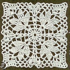 a white crocheted doily on a brown background