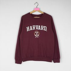 Vintage Rare HARVARD UNIVERSITY Crewneck Sweatshirt Big Logo Harvard Jumper Pullover Harvard Sweater Maroon Colour Unisex Large Size CONDITION :- ✅GOODUSED CONDITION. ✅NO STAINS  ✅NO HOLE  ITEM DESCRIPTION:- ✅SIZE: LARGE ✅MATERIAL : COTTON MEASUREMENT:- ✅ARMPIT TO ARMPIT : 20 INCH ✅LENGHT BACK COLOR/NECK TO HEM : 25 INCH ✅SHOULDER : 20 INCH ✅SLEEVE LENGTH: 22 INCH PLEASE REFER PHOTO BEFORE ORDER ALL MEASUREMENTS ARE TAKEN WITH THE GARMENT FLAT ON THE GROUND THE PARCEL WILL BE ARRIVE WITHIN 10-14 DAYS WORKING DAYS OR MORE DUE TO THE LOCATION & CUSTOMS CLEARINGS. BUYER DON'T HESITATE TO ASK ME IF ANY INQUIRY ABOUT ITEM BEFORE PURCHASING. PLEASE BEWARE THESE ARE VINTAGE ITEM. PLEASE CAREFULLY CHECK THE ITEM MEASUREMENT TO INSURE YOUR PROPER FIT AND AVOID THE WRONG PURCHASING. PLEASE LEAVE MAS Harvard Shirt, Harvard Sweater, Harvard Hoodie, Harvard Sweatshirt, Maroon Colour, University Crewneck, Prep Style, Designer Sweatshirts, University Sweatshirts