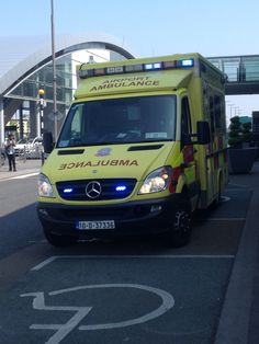 an ambulance is parked on the side of the road