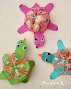 three plastic sea turtle toys with sunglasses on their heads, one in the shape of a turtle and one in the shape of a turtle