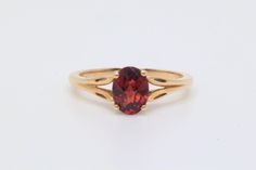 This ring features a CAD checkerboard Oval cut dark redish color Garnet accented by two small Diamonds all set into 10k solid gold. Weight: approx. 2.3 grams Size approx. 8 Markings : 10k Stone Info: Garnet: approx. 8.0x6.1mm oval As this is a pre-loved piece there are minor signs of wear that can include light marks in the metal and the surface of the stones. The ring has been polished to remove most of the surface scratches that the piece acquired over the years - there is still some remaining. Please note that colors may differ slightly depending on the settings of your device. The ring in the photos are the exact piece you will receive. We ship five days a week, Monday thru Friday. We will try to have your order shipped the next business day. Classic Yellow Gold Garnet Rings, Classic 14k Garnet Jewelry, Classic Garnet Jewelry Stamped 14k, Classic 14k Stamped Garnet Jewelry, Oval Garnet Ring Hallmarked, Classic Oval Ruby Ring In 14k Gold, Oval Garnet Ring In Yellow Gold, Dark Garnet, Diamond Solitaire